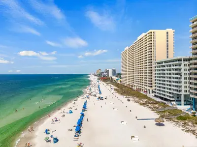 an aerial view of a beach and the ocean at Stunning Gulf Front 3BD Condo! with Beach Chair Service for 4! presented by Dolce Vita Getaways PCB! in Panama City Beach