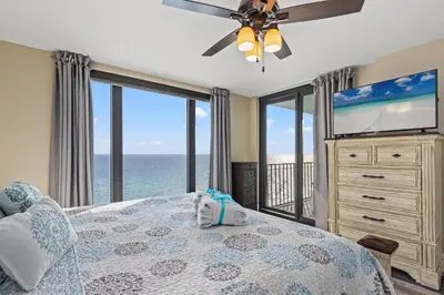 a bedroom with a bed with a ceiling fan at Watercrest 1704 - Serenity Shores in Panama City Beach