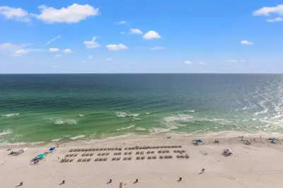 an overhead view of a beach with people and the ocean at Watercrest 1704 - Serenity Shores in Panama City Beach