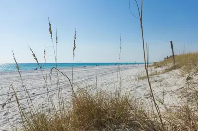 a beach with sand and the ocean in the background at Shores of Panama 1408 - Seaside Getaway in Panama City Beach