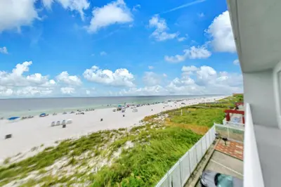 a view of the beach from the balcony of a beach house at Marisol 204 by Emerald Coast Retreats in Panama City Beach