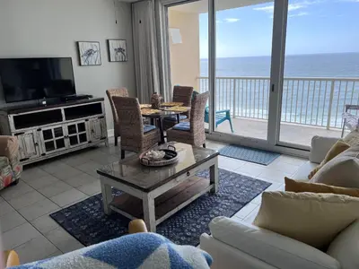 a living room with a view of the ocean at Majestic Beach Towers 905 in Panama City Beach