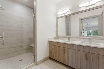 a bathroom with two sinks and a mirror at The Pointe Unit 326 by 30A Escapes in Rosemary Beach