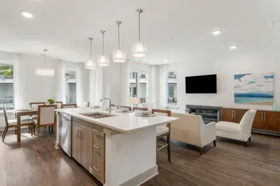 a kitchen and dining room with a table and chairs at The Pointe Unit 326 by 30A Escapes in Rosemary Beach