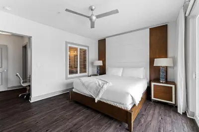 a bedroom with a large bed and a window at Texas Two Step by 30A Escapes in Rosemary Beach