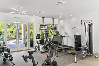a gym with treadmills and exercise bikes in a room at The Pointe Unit 342 by 30A Escapes in Rosemary Beach