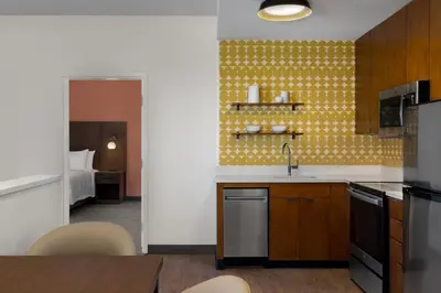 a kitchen with a sink and a stove top oven at Residence Inn Panama City Beach Pier Park in Panama City Beach