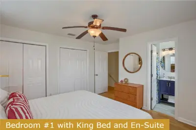 a bedroom with a bed and a ceiling fan at Estrella del Mar in Panama City Beach