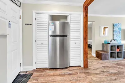 a kitchen with a stainless steel refrigerator in a room at Misty Harbour 7 in Panama City Beach