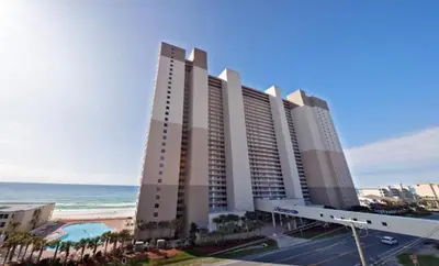 a large hotel with the ocean in the background at Tidewater 100 in Panama City Beach