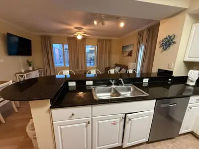 a kitchen with a sink and a counter top at Tidewater 100 in Panama City Beach