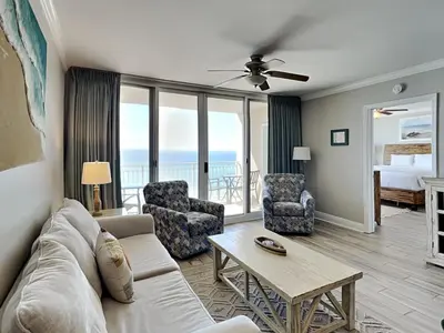 a living room with a couch and a table at Emerald Beach #830 in Panama City Beach
