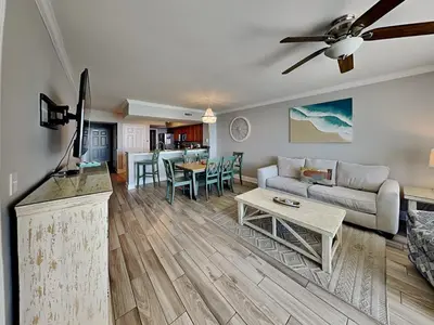 a living room with a couch and a table at Emerald Beach #830 in Panama City Beach