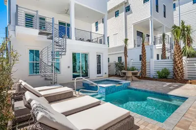a swimming pool in the backyard of a house at 30A Sunrise in Santa Rosa Beach