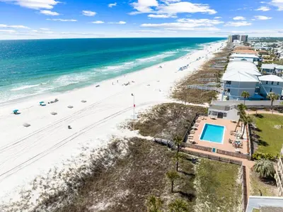 an aerial view of the beach and the ocean at Howdy Beach by 30A Escapes in Panama City Beach