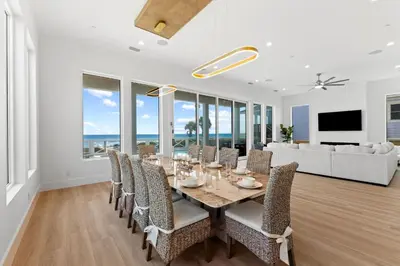 a dining room with a table and chairs at Jewel of Oleander by 30A Escapes in Panama City Beach