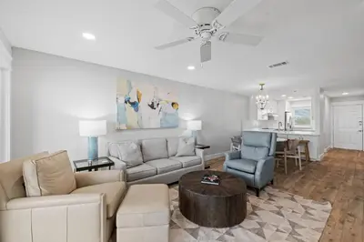 a living room with a couch and a table at Ramsgate Harbour #5 by 30A Escapes in Panama City Beach