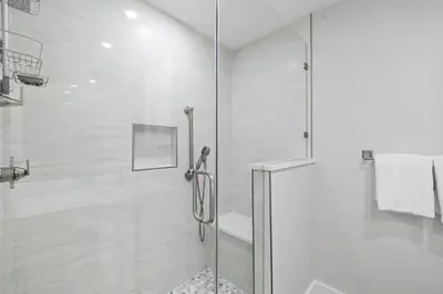 a shower with a glass door in a bathroom at Ramsgate Harbour #5 by 30A Escapes in Panama City Beach