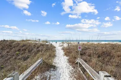 a path through the sand on a beach at Ramsgate Harbour #5 by 30A Escapes in Panama City Beach