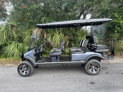a golf cart is parked on the street at Barefoot Dreams! in Panama City Beach
