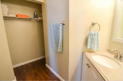 a bathroom with a sink and a toilet and towels at Beach Place Seconds to Beach 6 in Panama City Beach