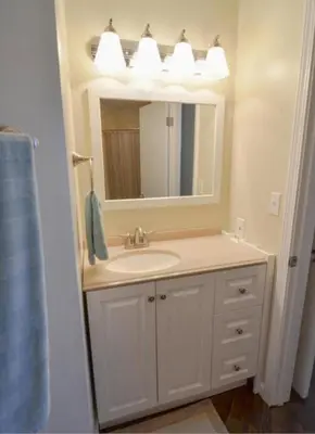 a bathroom with a sink and a mirror at Beach Place Seconds to Beach 6 in Panama City Beach