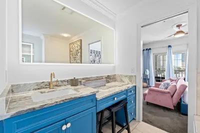 a bathroom with a sink and a mirror at Beach House - Sea La Vie by Panhandle Getaways in Panama City Beach