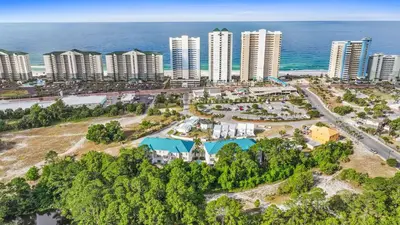 an aerial view of a city with buildings and the ocean at Beach House - Sea La Vie by Panhandle Getaways in Panama City Beach