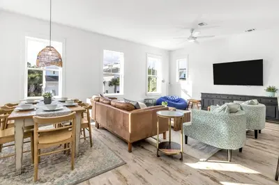 a living room with a couch and a table at Salty Sons 4 BR and just minutes to the Beach Rosemary and 30Avenue in Inlet Beach