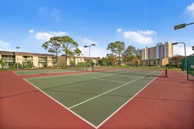 a tennis court with two tennis courts at Gulf Highlands 146 by Book That Condo in Panama City Beach