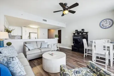 a living room with a couch and a table at Majestic Beach Resort 1411-1 by Book That Condo in Panama City Beach