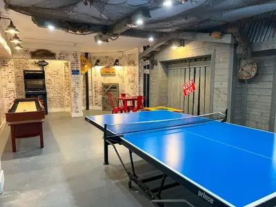 a ping pong table in a ping pong room at Beachfront Studio - Perfect Location - Free Beach Chairs in Panama City Beach