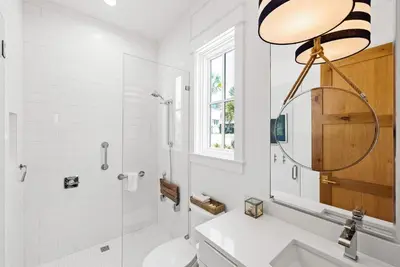 a bathroom with a shower and a toilet and a sink at Salt & Light - 5 BR, Sleeps 18, Gulf & Lake Views, Game Room & Bikes in Seagrove Beach