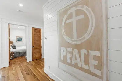 a room with a peace sign on the wall at Salt & Light - 5 BR, Sleeps 18, Gulf & Lake Views, Game Room & Bikes in Seagrove Beach