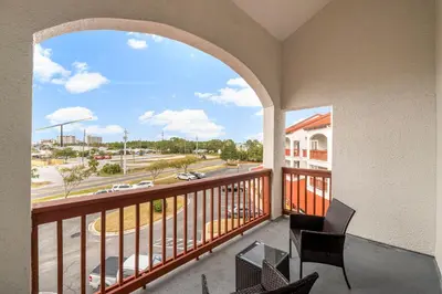 a balcony with a view of a street at The Inn At St Thomas Square #1305A in Panama City Beach