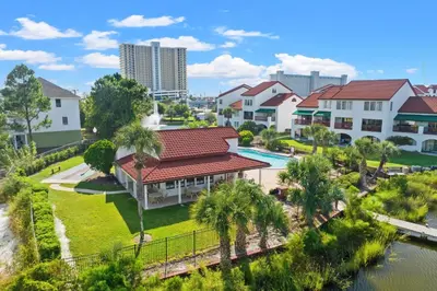 an aerial view of a resort with a pool and buildings at The Inn At St Thomas Square #1305A in Panama City Beach