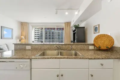 a kitchen with a sink and a window at Shores Of Panama #1509 in Panama City Beach