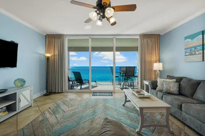 a living room with a couch and a ceiling fan at Palazzo #505 by InJoy Vacations in Panama City Beach