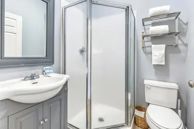 a bathroom with a shower and a sink and a toilet at Coastside 2 BR with 2BA Sleeps 6 Bikes and Pool View in Santa Rosa Beach