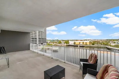 a balcony with a view of a city at Laketown Wharf #320 by Nautical Properties in Panama City Beach