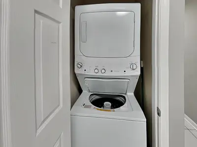 a washer and dryer with a computer on top of it at Horizon South 60-203 in Panama City Beach