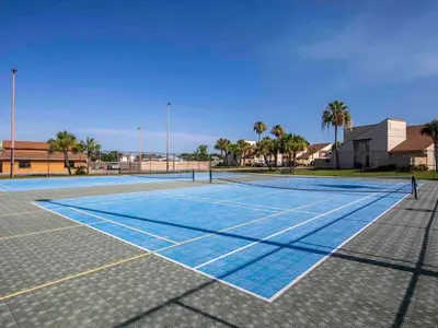 a tennis court with a person standing on it at Horizon South 60-203 in Panama City Beach