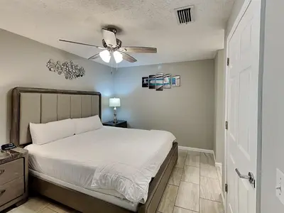 a bedroom with a bed and a ceiling fan at Horizon South 60-203 in Panama City Beach