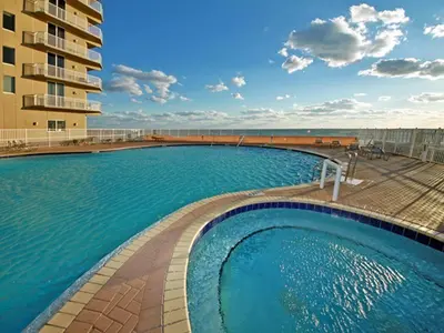 a large swimming pool in front of a building at Tidewater Beach Resort #1501 in Panama City Beach