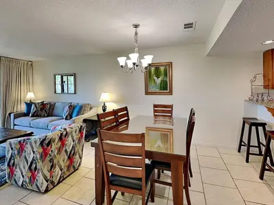 a living room with a couch and a table at Edgewater Villa #2607 in Panama City Beach