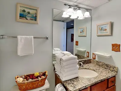 a bathroom with a sink and a mirror at Edgewater Villa #2607 in Panama City Beach