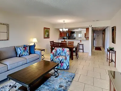 a living room with a couch and a table at Edgewater Villa #2607 in Panama City Beach