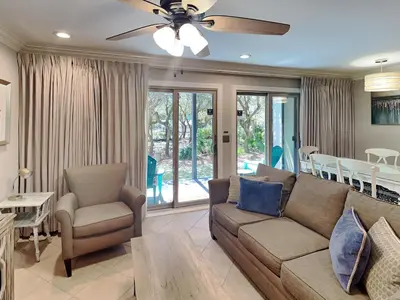 a living room with a couch and a ceiling fan at Inlet Dunes #102 in Inlet Beach