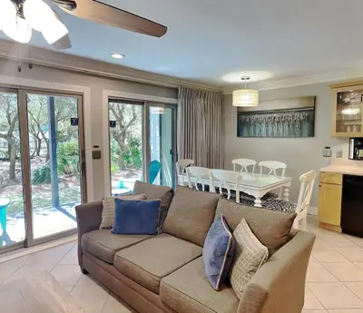 a living room with a couch and a table at Inlet Dunes #102 in Inlet Beach