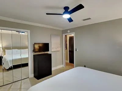 a bedroom with a bed and a ceiling fan at Inlet Dunes #102 in Inlet Beach